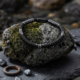 Herren-Perlenarmband aus Edelstahl mit Kreuzschädel-Motiv