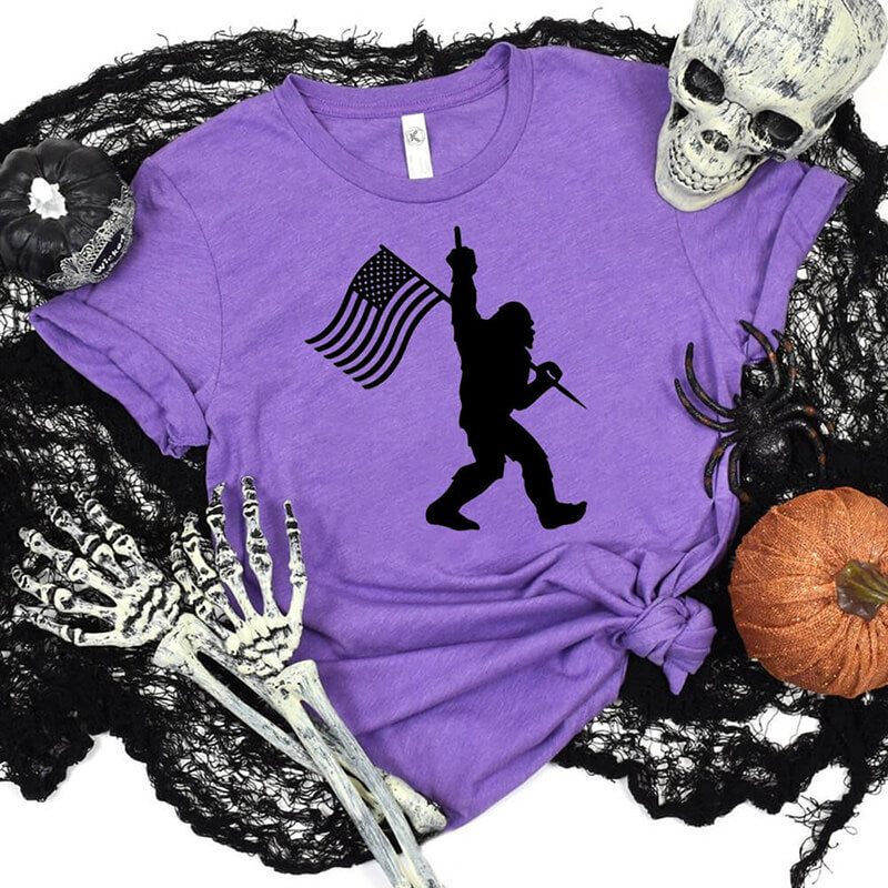 Bigfoot Holding A Flag Short Sleeve T-shirt | Gthic.com