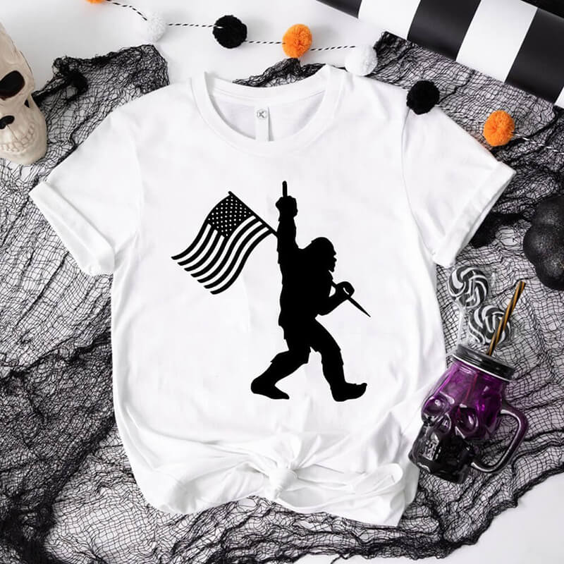 Bigfoot Holding A Flag Short Sleeve T-shirt | Gthic.com