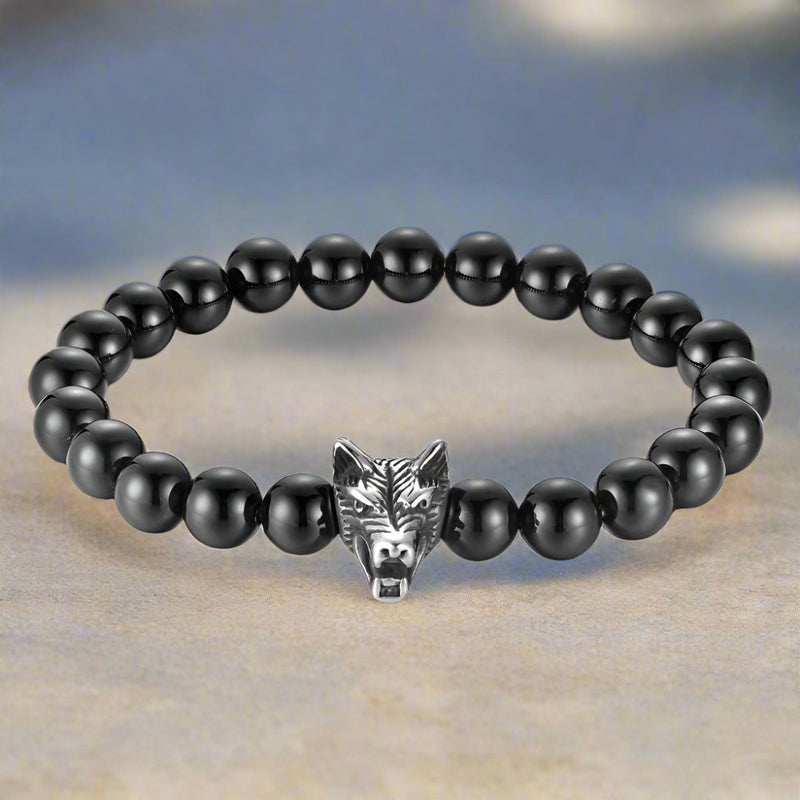 Black beaded bracelet with a silver wolf head