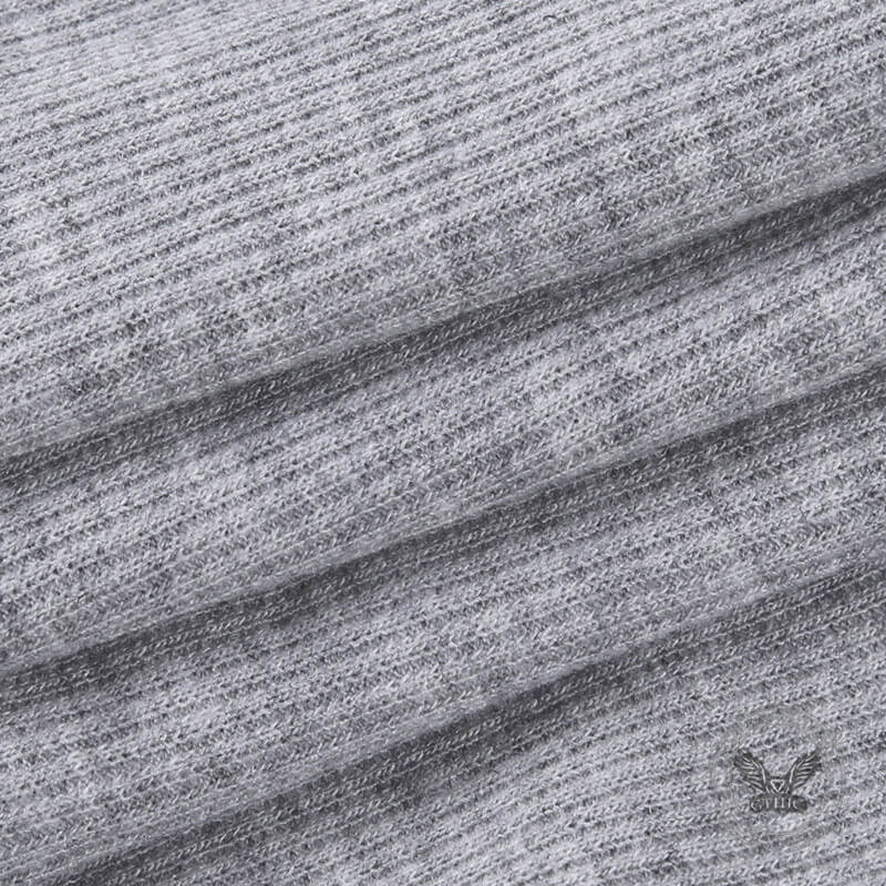 Top corto de manga larga con cremallera y cuello en V de color liso