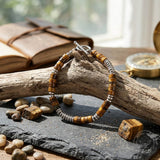 Herren-Perlenarmband aus Edelstahl mit Kreuzschädel-Motiv